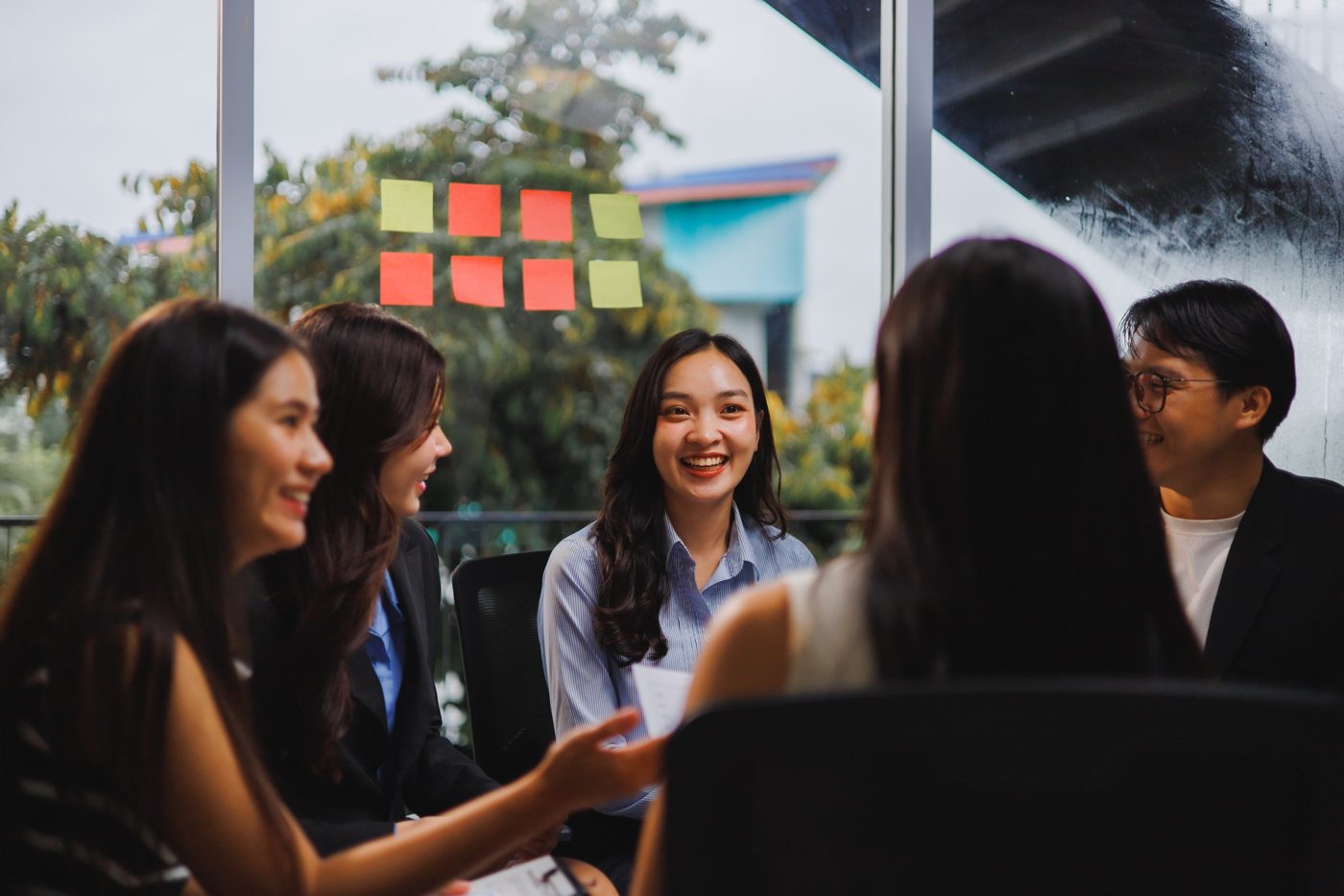 Team members smiling together in a meeting